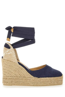 Navy blue canvas espadrille wedge sandal with woven jute sole and ankle strap tied in a bow by Castañer women