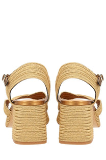 Beige woven espadrille sandals with braided rope heel and metallic buckle accents from castañer women’s vallita gold collection
