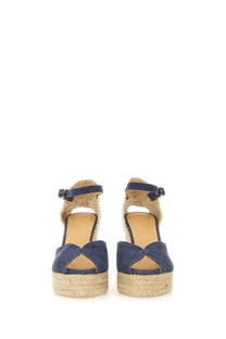 Navy blue suede espadrille wedge sandals with woven jute straps and ankle buckles from castañer women