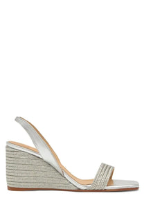 Castañer women’s silver espadrille wedge sandal with metallic straps and woven straw heel front view