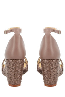 Castañer women’s beige leather wedge sandals with woven straw heel and ankle strap for casual wear