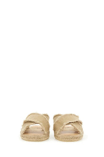 Castañer women’s beige canvas slide sandals with frayed edges and woven espadrille soles