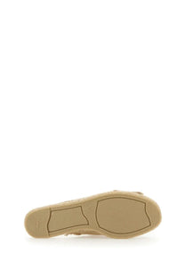 Beige espadrille sandal for women by castañer with woven rope sole and rubberized heel grip shown from the back side