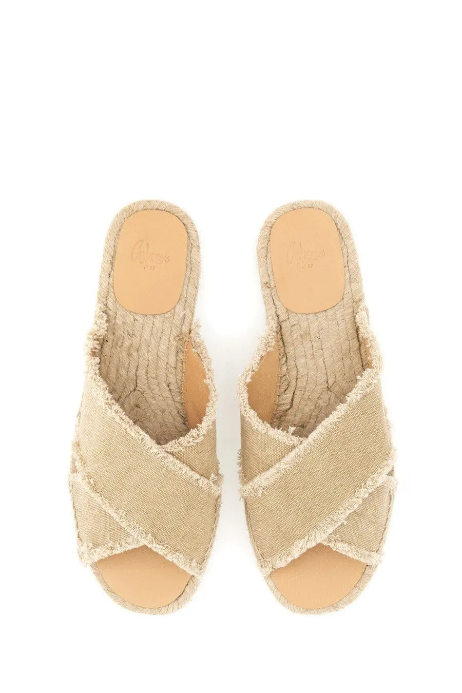 Beige woven espadrille sandals with cross-over design and frayed edges from castañer women’s sandal palmera collection