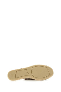 Beige espadrille sole with woven texture and stitched detailing on castañer women’s sandal palmera brown