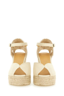 Cream-colored castañer women’s sandalwood espadrille wedge sandals with woven jute platform and ankle strap