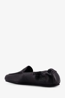 Celine mens adam black leather slip on loafer with sleek minimalist design and elasticized heel for comfort
