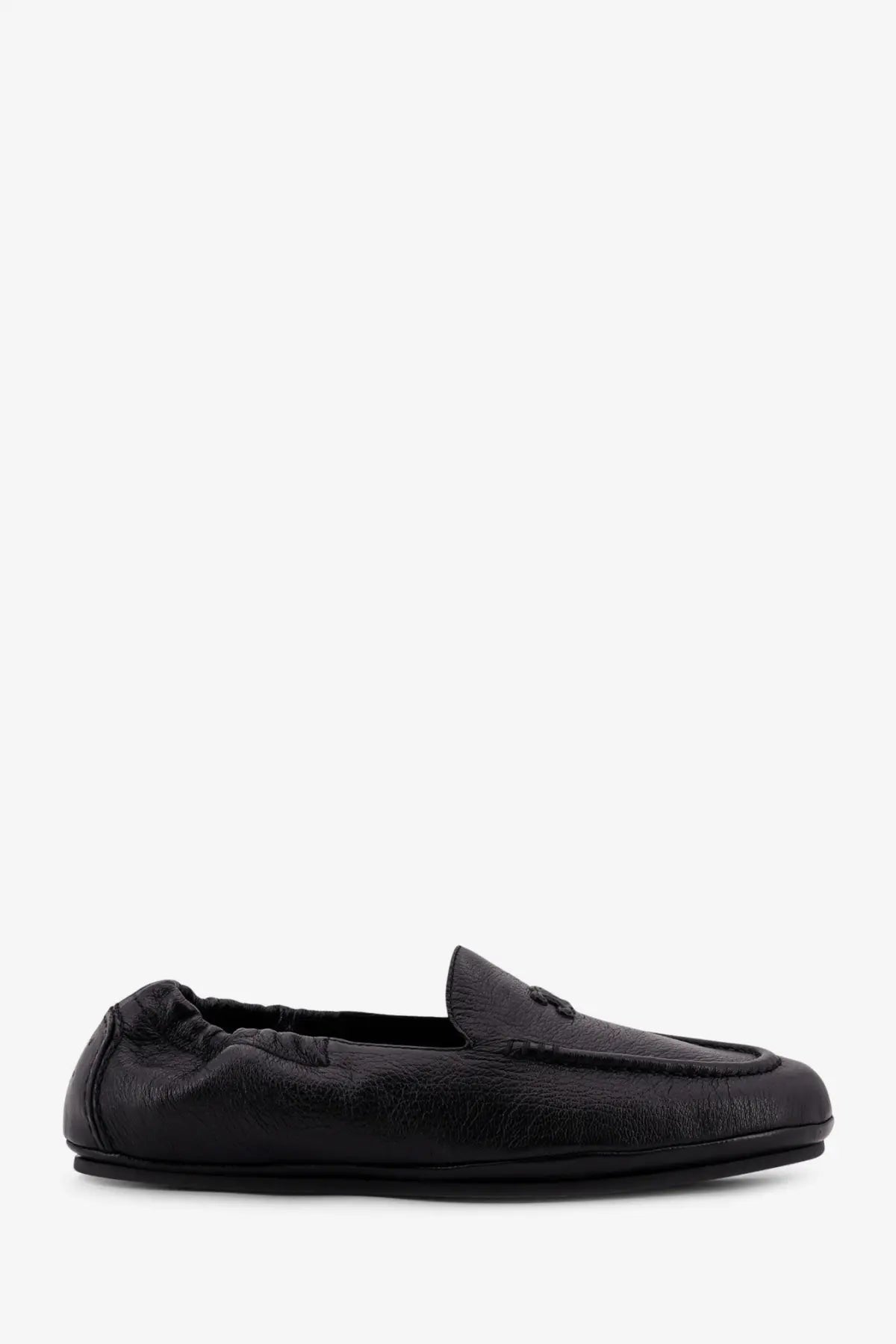 Celine men’s adam leather slip on loafers in black with a subtle textured finish and decorative emblem on the vamp