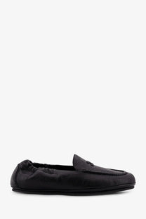 Celine men’s adam leather slip on loafers in black with a subtle textured finish and decorative emblem on the vamp