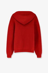 A vibrant red long sleeved hooded sweatshirt with ribbed cuffs and hem in cashmere and wool blend for men by Celine