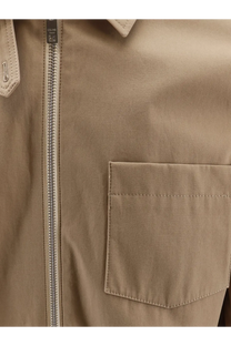 Beige celine men’s cotton trench coat with silver zipper and matching pocket featuring subtle stitching details