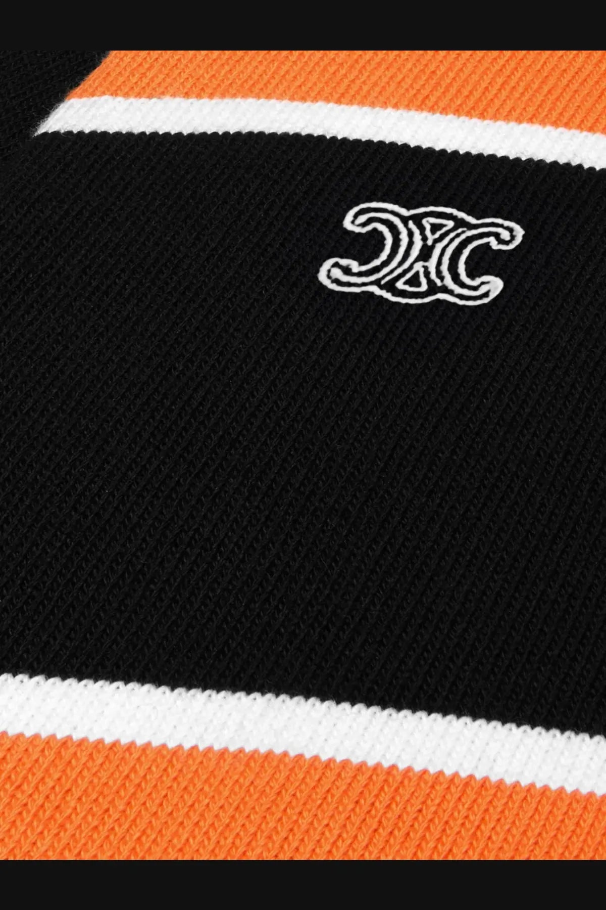Celine men’s black cotton polo shirt with black and orange striped knit sweater and white embroidered logo