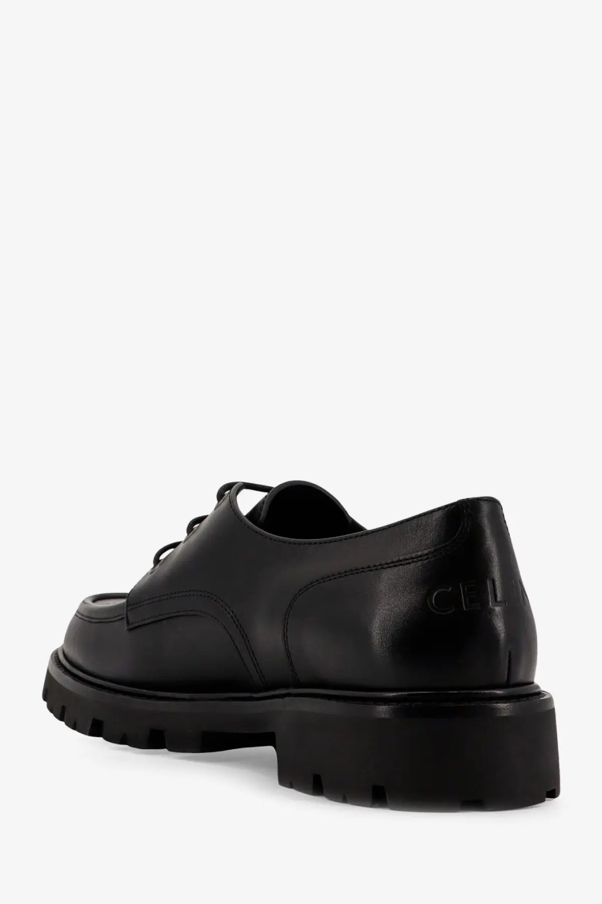 Black leather celine men’s derby margaret lace-up shoe with chunky rubber sole and embossed cel branding on heel back view