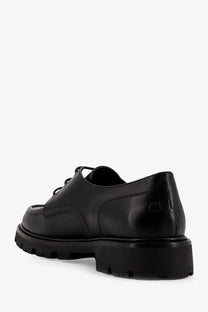 Black leather celine men’s derby margaret lace-up shoe with chunky rubber sole and embossed cel branding on heel back view