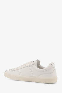 Celine men’s low top leather sneaker in cream with subtle perforations and minimalist design