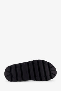 Black rubber sole with deep textured treads on the back of Celine men’s sandali in tela jacquard black