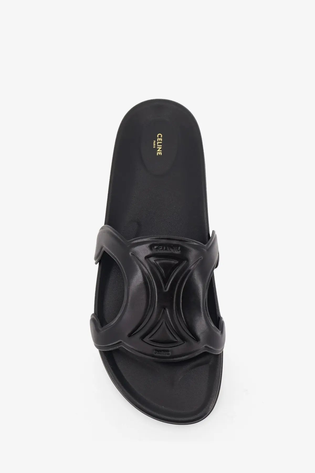 Black Celine men’s triomphe leather slide sandal with glossy sculpted strap and embossed geometric design