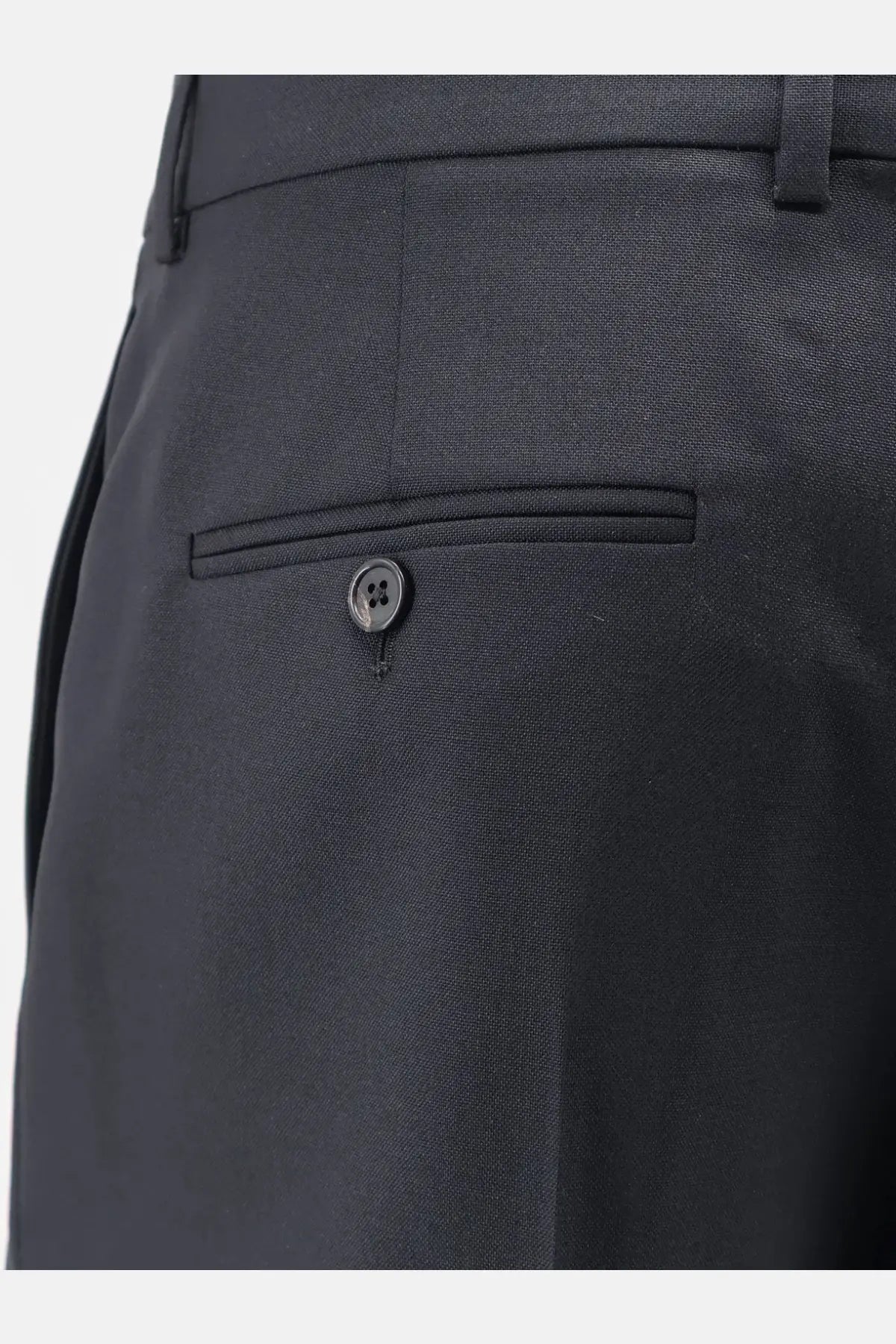 Back view of dark gray celine men’s wool and mohair trousers with textured fabric and single button back pocket closure