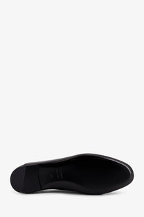 Celine women’s aura slip on leather loafers in black with a sleek minimalist design and glossy finish