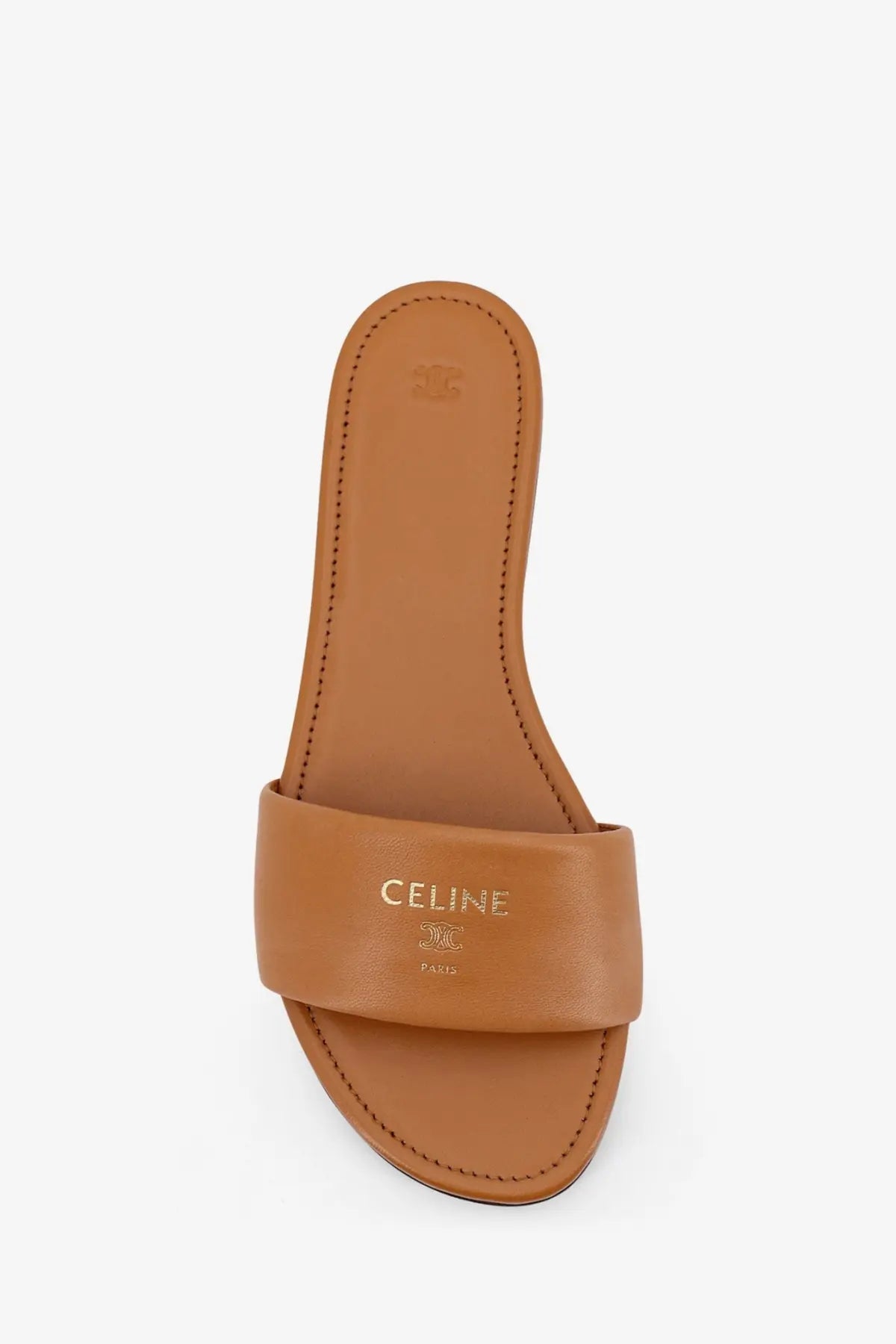 Tan leather celine coast mule slide sandal with gold-tone branding in sahara color for women
