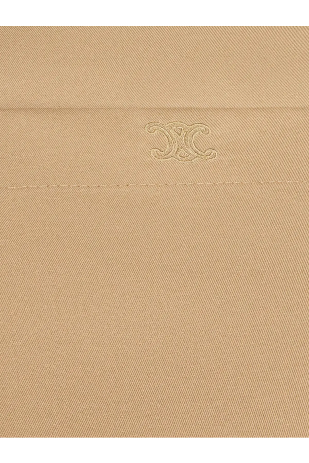 Beige cotton and silk dress by celine featuring subtle embroidered logo on beige cotton fabric