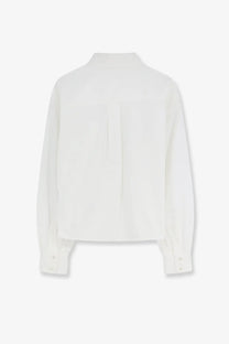 Back of celine women’s cropped denim white button-up shirt with subtle faint logo on denim fabric