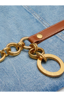 Gold-tone chain strap with brown leather tab and circular celine logo tag on celine women’s blue denim jacket