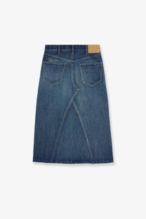 A mid-blue celine women’s denim midi skirt with a straight cut two back pockets and a diagonal center seam back view