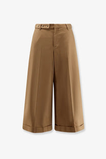 Celine women’s dock cotton beige trousers with wide-leg cropped fit, buttoned belt loops, and rolled cuffs