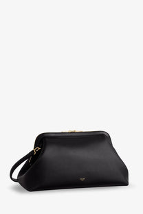 Black celine women’s doctor leather shoulder bag with gold-tone hardware and sleek structured clutch design