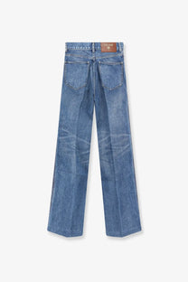 Celine women’s blue denim jeans with classic straight-leg cut and brown leather brand label at waistband back view