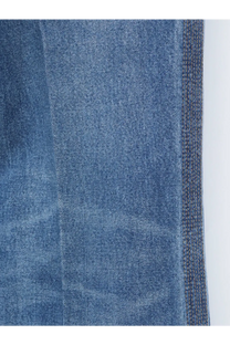 Blue denim fabric with textured weave and visible stitching on the seam of celine womens flared cotton jeans brown