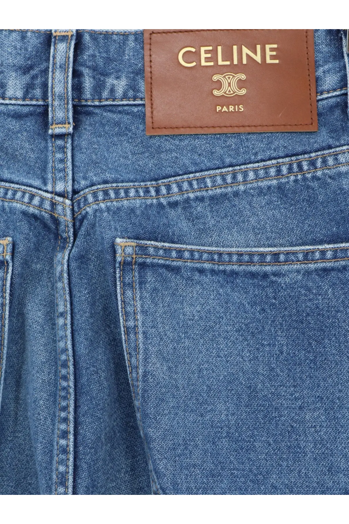 Blue denim flared cotton jeans with a brown leather celine paris brand patch on the back side