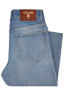 Celine women’s light-wash blue denim jeans with a brown leather Celine Paris brand label on the waistband back side