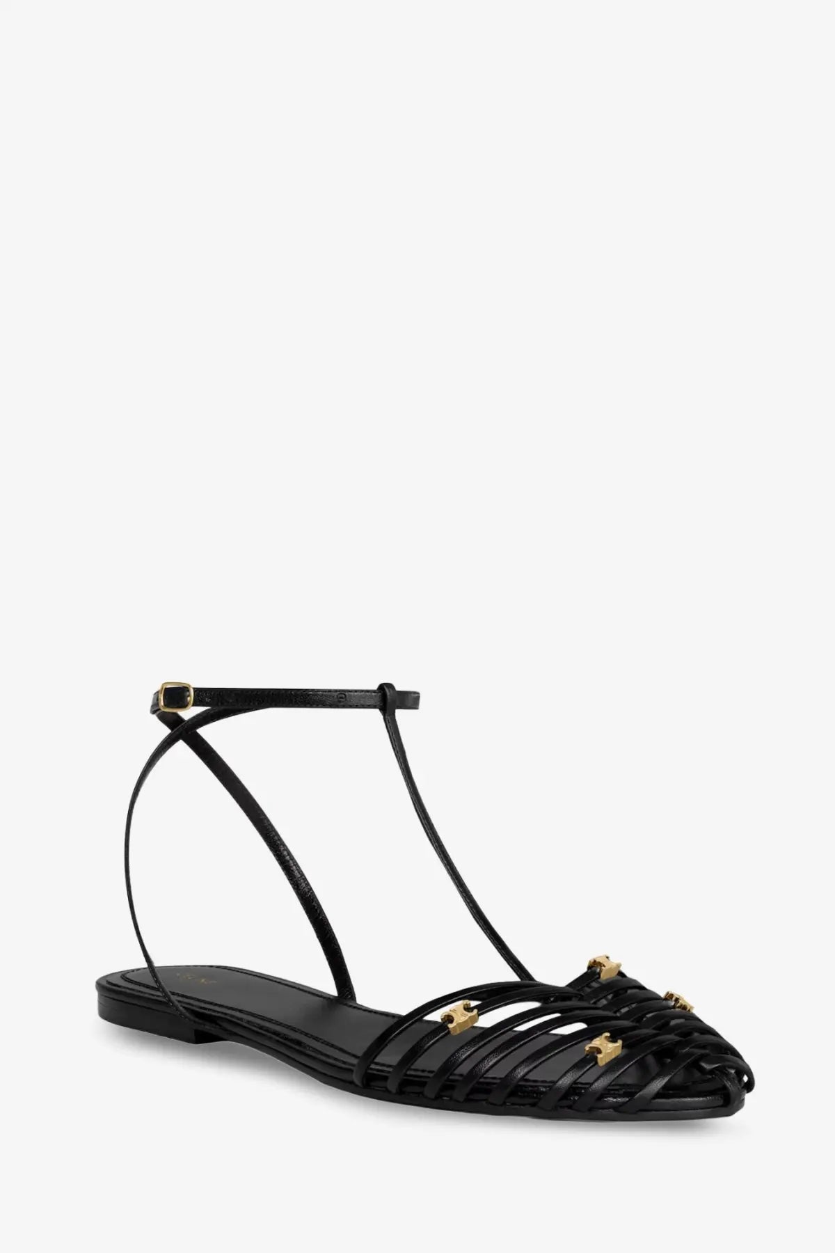 Celine women’s black leather flat sandals with t-strap design and gold-tone star-shaped embellishments