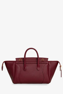 Burgundy leather céline classic medium speedy handbag with gold-tone hardware and top handles for women