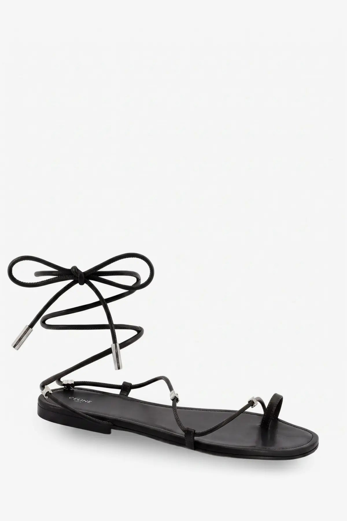 Black Celine women’s leather flat sandal with slender straps and silver-toned metal accents