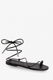 Black Celine women’s leather flat sandal with slender straps and silver-toned metal accents
