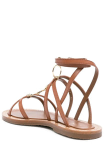 Celine women’s tan leather strappy sandal with gold-tone metal accents and circular ring detail brown Lympia model