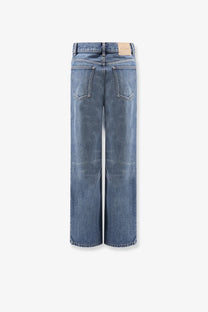 Back side of Celine women’s stone washed cotton wide-leg denim jeans in medium-wash blue with classic stitching and pockets