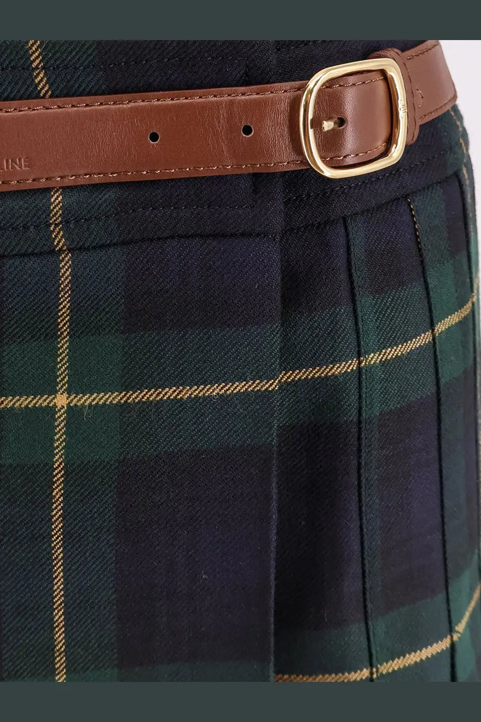 Celine women’s tartan wool kilt miniskirt in navy and green plaid with a brown leather belt and gold buckle