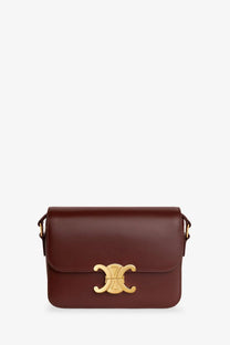 Celine women’s teen triomphe leather crossbody bag in rich burgundy with a gold-tone c-shaped clasp