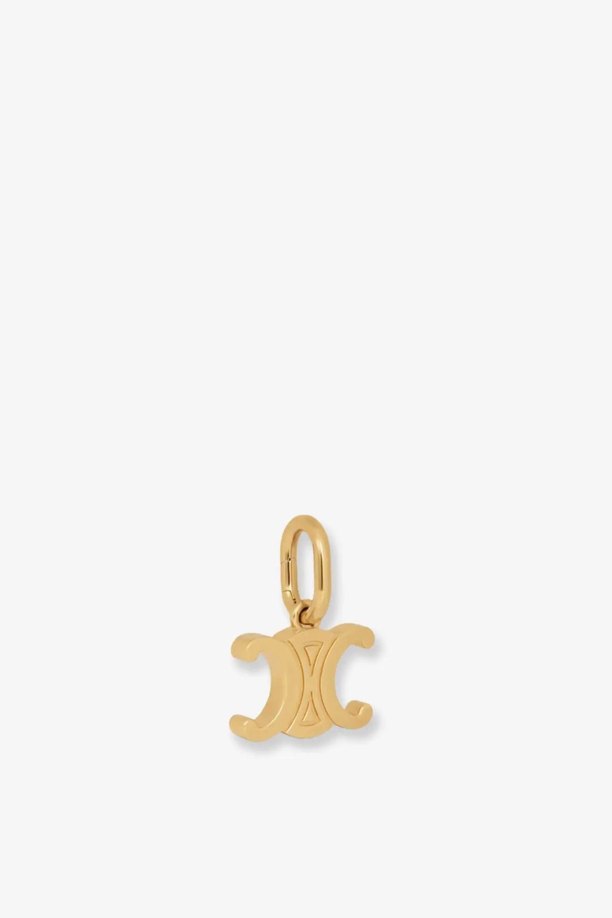 Gold-colored celine women’s celine triomphe brass charm with polished metallic finish and interlocking cc design