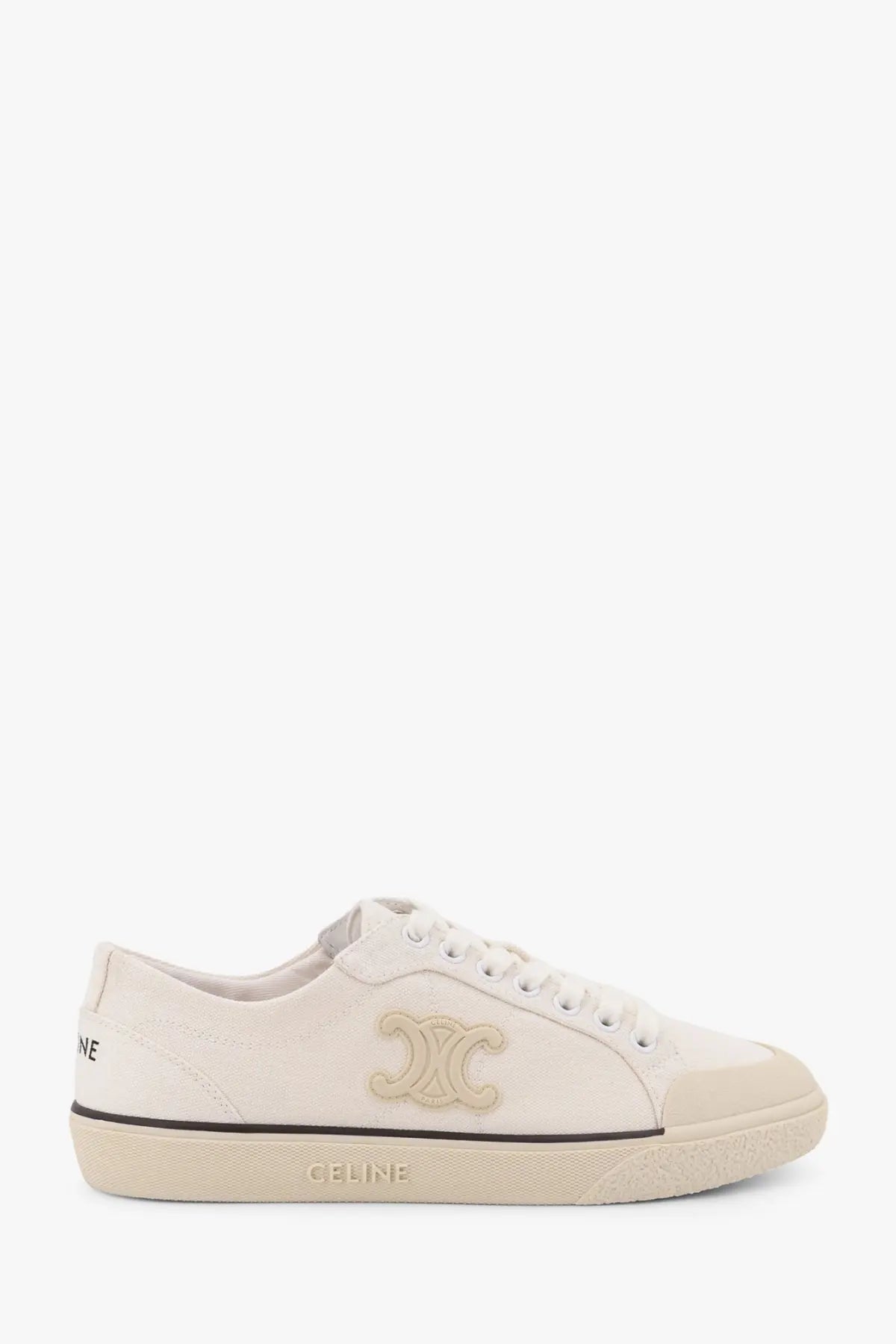 Cream-colored Celine women’s triomphe canvas sneaker with gold-tone interlocking c logo and black stitching details