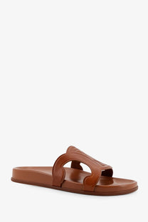 Brown leather slide sandal in beige with a distinctive sculpted strap design from celine womens triomphe collection