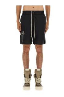 Black nylon Champion x Rick Owens men’s athletic shorts with white embroidered logo and matching drawstrings on left thigh