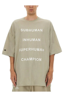 Oversized olive green champion x rick owens men’s t-shirt with bold white subhuman inhuman superhuman champion lettering