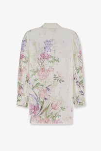 Charo Ruiz Ibiza women’s aster shirt white delicate ivory blouse with vibrant pink purple and green floral pattern