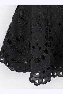 Black embroidered lace skirt with intricate cut-out patterns and scalloped hem from charo ruiz ibiza women’s bail short dress