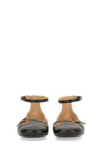 Chloé women’s ballerina Misty black patent leather flats with gold-tone buckle detail on front